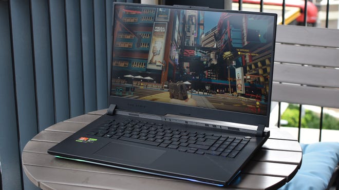 Cyberpunk 2077 running on an Asus ROG Strix Scar 17 gaming laptop.