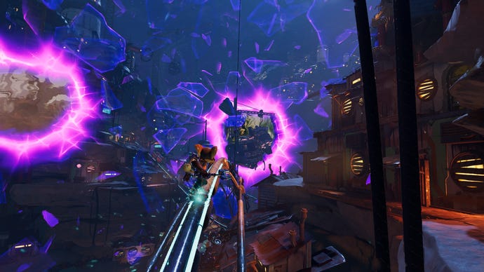 Ratchet grinds along a rail as interdimensional rifts appear in the sky in Ratchet & Clank: Rift Apart.